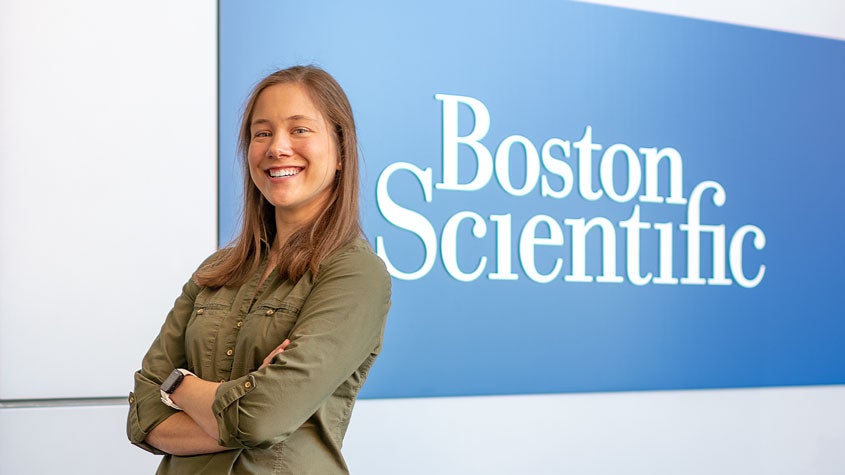 Abby Brooks in front of Boston Scientific