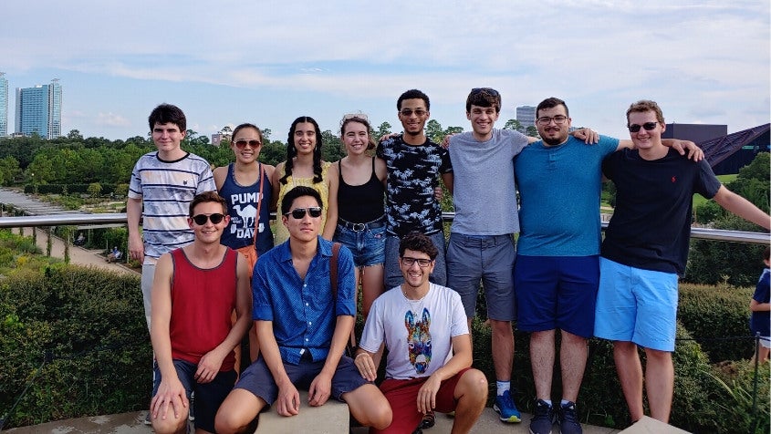 A group of first-year bioengineering graduate students stops at nearby Hermann Park as they explore the city.