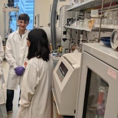 Students learning about the development of bioinks for 3D printing from a graduate student.