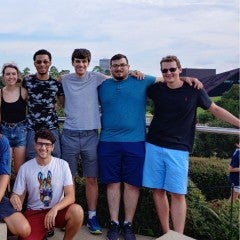 A group of first-year bioengineering graduate students stops at nearby Hermann Park as they explore the city.