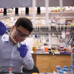 Photo of George Lu in the lab.